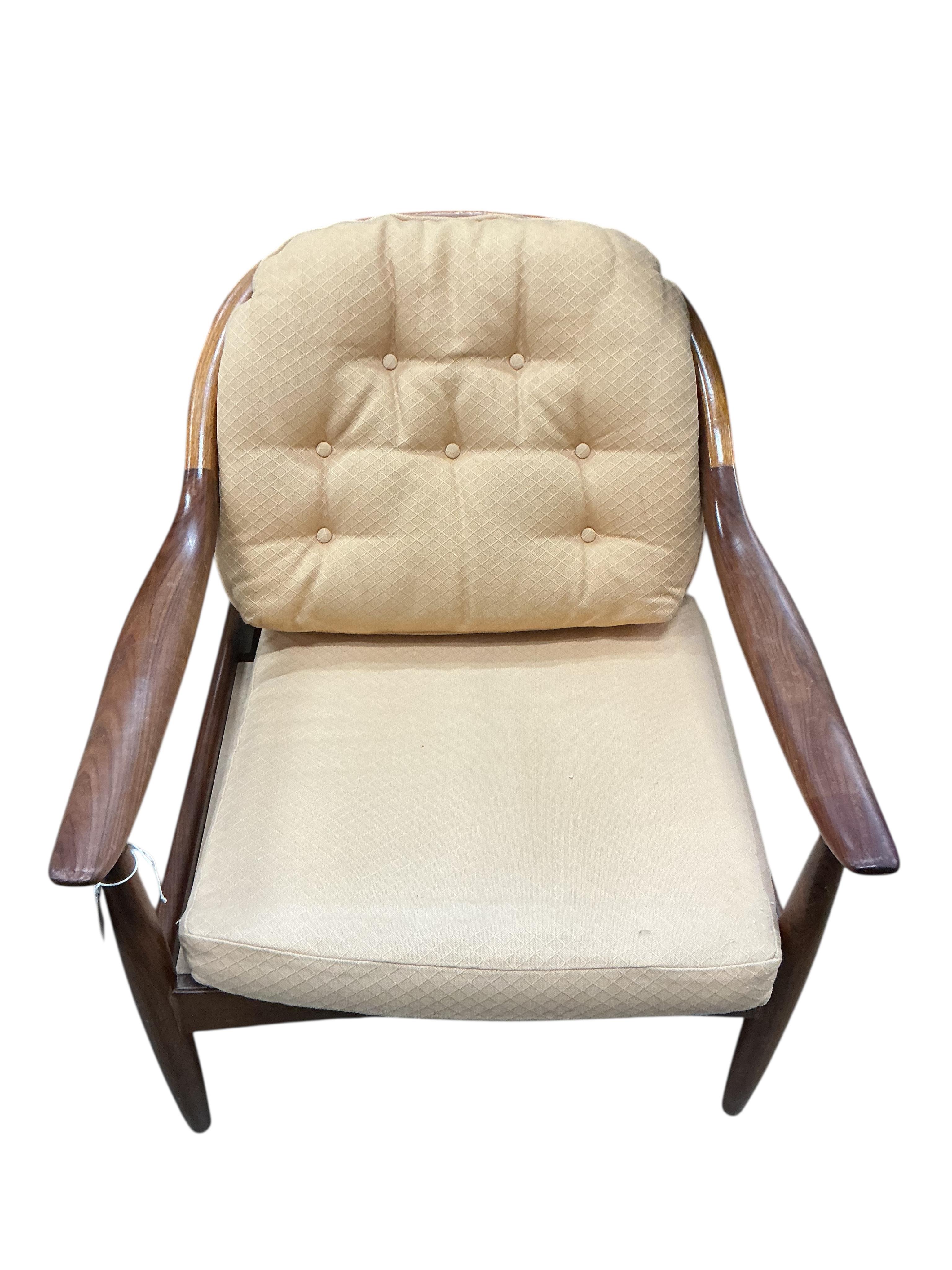 Greaves and Thomas: A pair of mid century teak stick back armchairs, width 62cm, depth 70cm, height 70cm